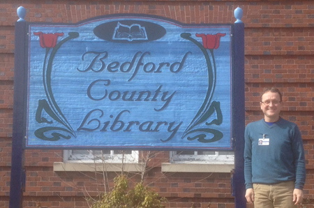 David Stewart, a Navigator in Pennsylvania, stands outside of the Benford County Library, where he helps people understand their insurance options and enroll in coverage.  